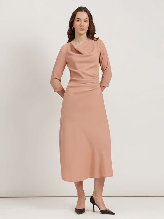 Woman wearing a pink dress against a white background